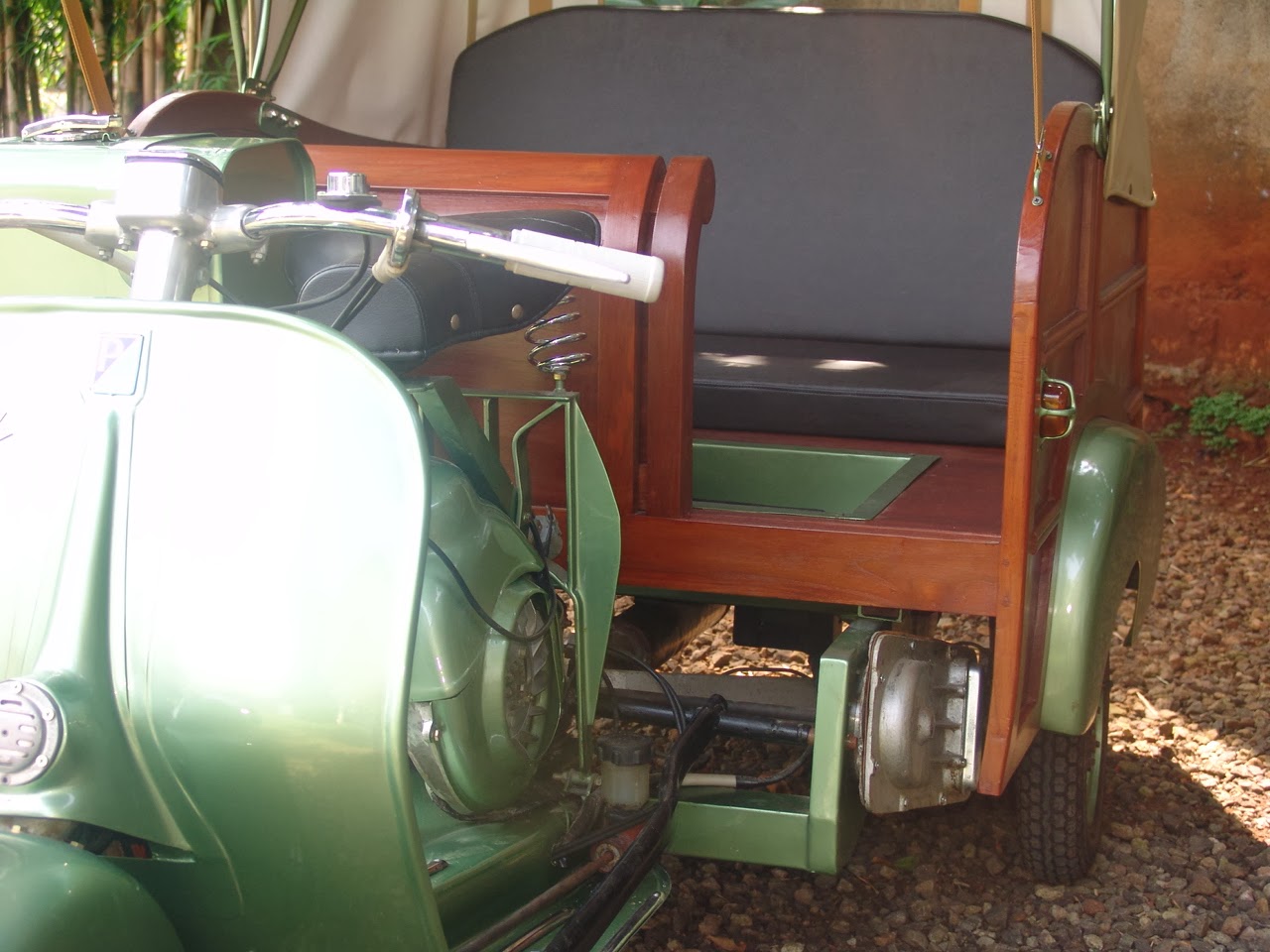 Interior teakwood cabin and foldable canvas roof on Ape Calessino Green